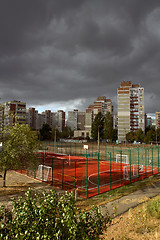 Image showing Urban landscape with dark storm sky