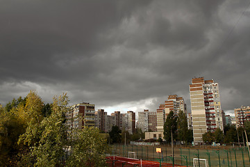 Image showing Urban landscape with dark storm sky