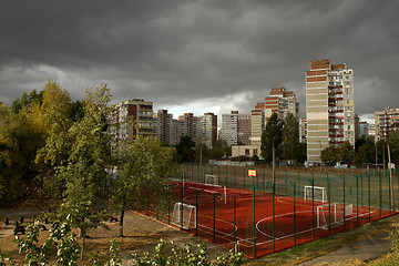 Image showing Urban landscape with dark storm sky