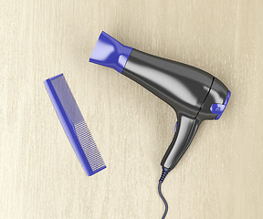 Image showing Hair dryer and comb