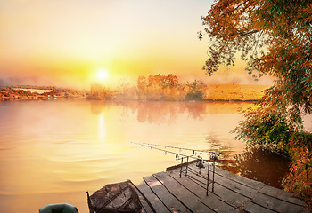 Image showing Fishing equipment on wooden pier 