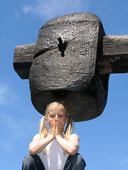 Image showing Girl under large hammer