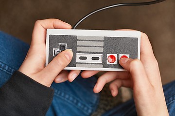 Image showing Playing an old gaming console