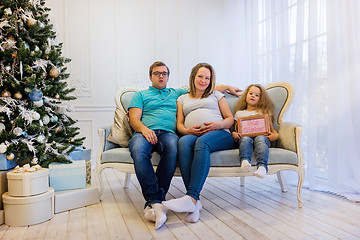 Image showing Family portrait near christmas tree