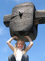 Image showing Girl under large hammer