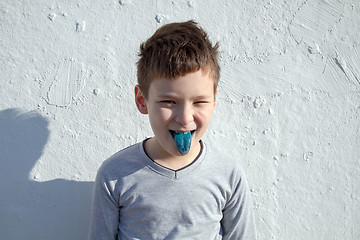 Image showing Boy with blue lollipop