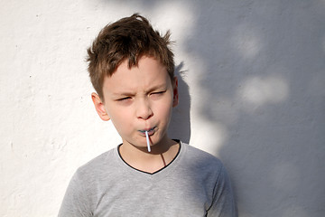 Image showing Boy with blue lollipop