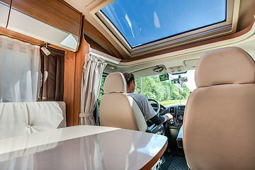 Image showing Man driving on a road in the Camper Van RV