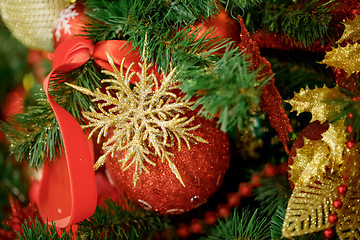 Image showing Red Christmas ball hanging on Christmas tree.