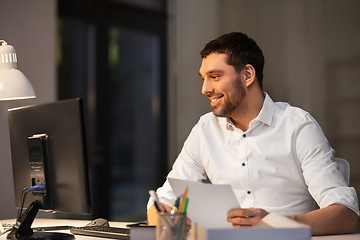 Image showing businessman with computer working at night office