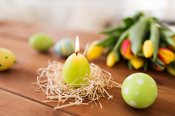 Image showing candle in shape of easter eggs and tulip flowers