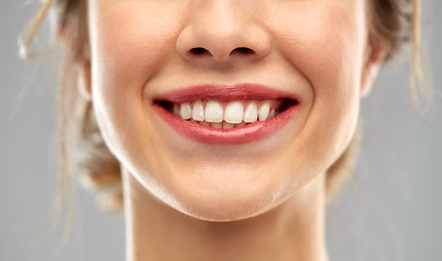 Image showing close up of smiling woman face with white teeth