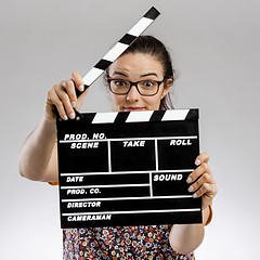 Image showing Woman with a clapboard