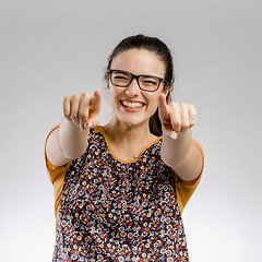 Image showing Happy woman pointing