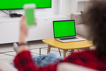 Image showing young man in bathrobe enjoying free time