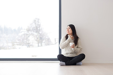 Image showing asian woman enjoying morning coffee