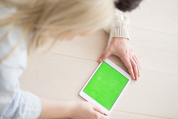 Image showing Young Couple using digital tablet on cold winter day