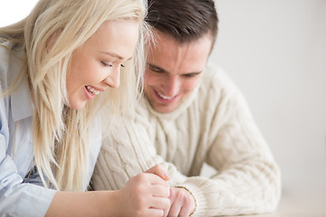 Image showing Young Couple using digital tablet on cold winter day