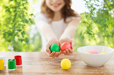 Image showing close up of girl holding colored easter eggs