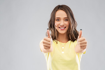 Image showing young woman or teenage girl showing thumbs up