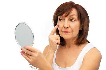 Image showing portrait of smiling senior woman with mirror