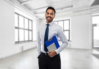 Image showing indian businessman or realtor in empty office room