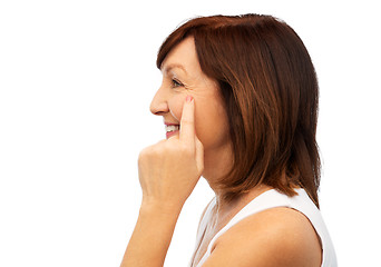 Image showing profile of senior woman pointing to eye wrinkles