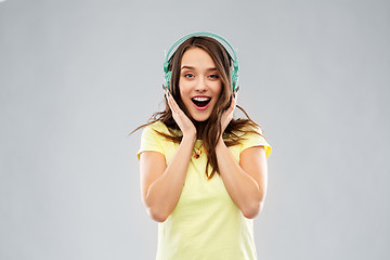 Image showing happy young woman or teenage girl with headphones