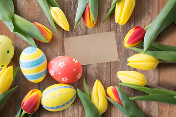 Image showing close up of colored easter eggs and tulip flowers
