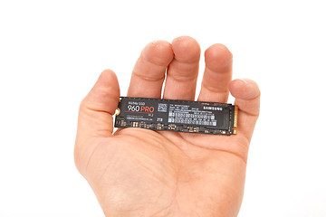 Image showing Circuit Board of an SSD held in hand