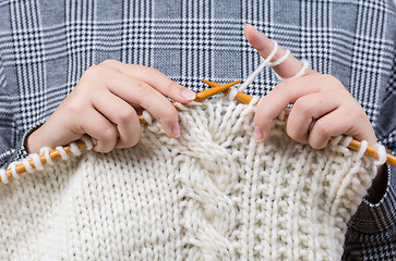 Image showing Close up of hands knitting