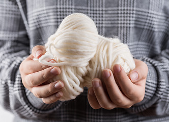 Image showing Detail of hands holding wool for knitting