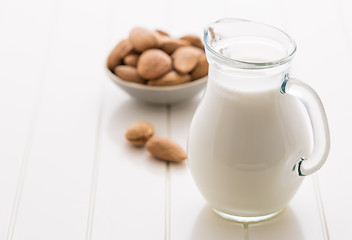 Image showing Jar of almond milk with almond nuts