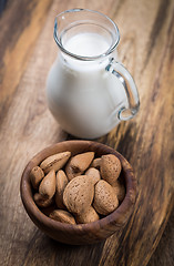 Image showing Jar of almond milk with almond nuts