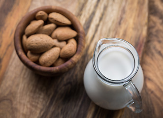 Image showing Jar of almond milk with almond nuts