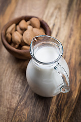 Image showing Jar of almond milk with almond nuts