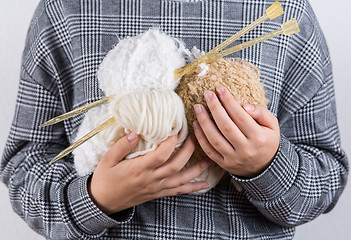 Image showing Detail of hands holding wool for knitting