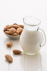 Image showing Jar of almond milk with almond nuts