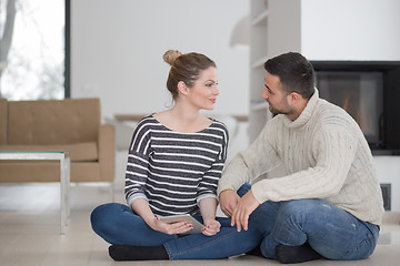 Image showing Young Couple using digital tablet on cold winter day