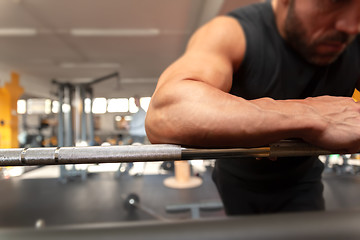 Image showing a strong man relaxes in the gym