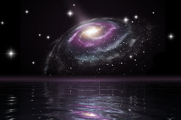 Image showing spiral galaxy over the ocean