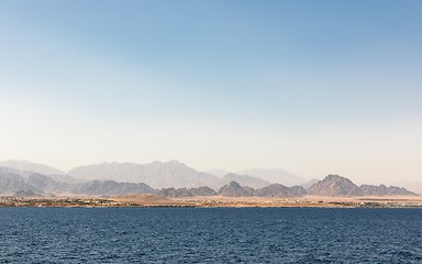 Image showing land over the horizon under blue sky