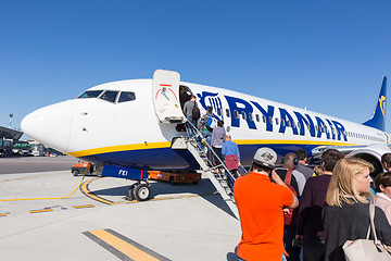 Image showing Trieste airport, Italy - 20 April 2018: People boarding Ryanair plane on Friuli Venezia Giulia Airport in Trieste, italy on April 20th, 2018. Ryanair is the biggest low-cost airline company in Europe