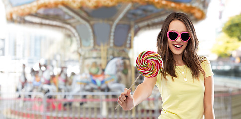 Image showing teenage girl in sunglasses with lollipop