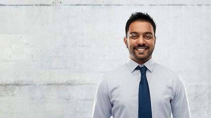 Image showing indian businessman in shirt with tie over concrete