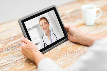 Image showing senior woman patient having video call with doctor