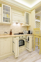 Image showing Luxury modern beige kitchen closeup, some drawers open