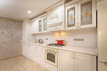 Image showing Luxury modern white and beige kitchen interior