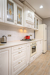 Image showing Luxury modern white and beige kitchen interior