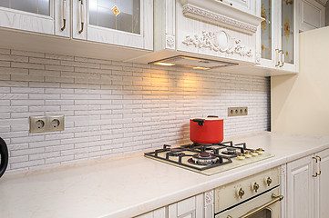 Image showing Luxury modern white and beige kitchen interior